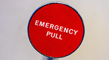 red button with the words "emergency pull"